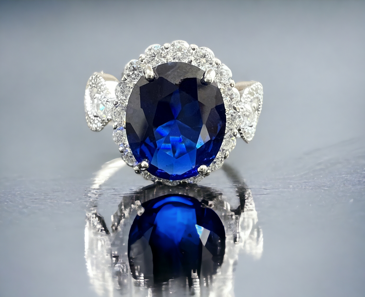 925 Sterling Silver Infinity Oval Cut Sapphire Blue CZ Ring