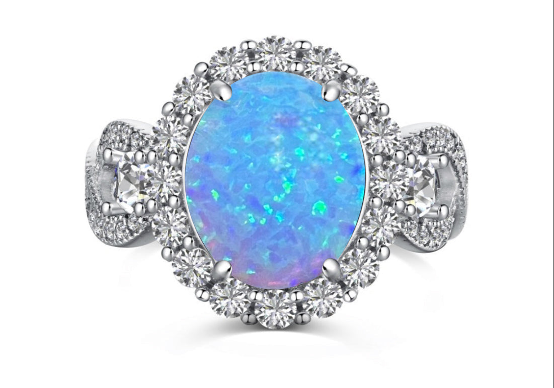 925 Sterling Silver Infinity Oval Cut Lab-Grown Blue Fire Opal & Diamond CZ